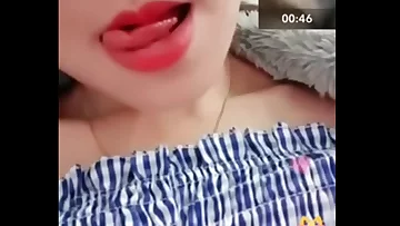 Cute flat Asian shows me her small tits and rubs her thong in random chat