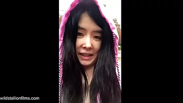 Chinese Teen stars in Bollywood Spectacular and then flashes big breasts outdoors in the rain