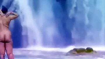 Desi publicly nude in front of water fall.