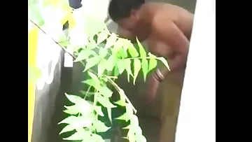 Big boobs Desi bhabhi nude bathing neighbor boy caught by hidden cam