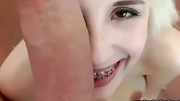 Young looking teen handles a huge cock